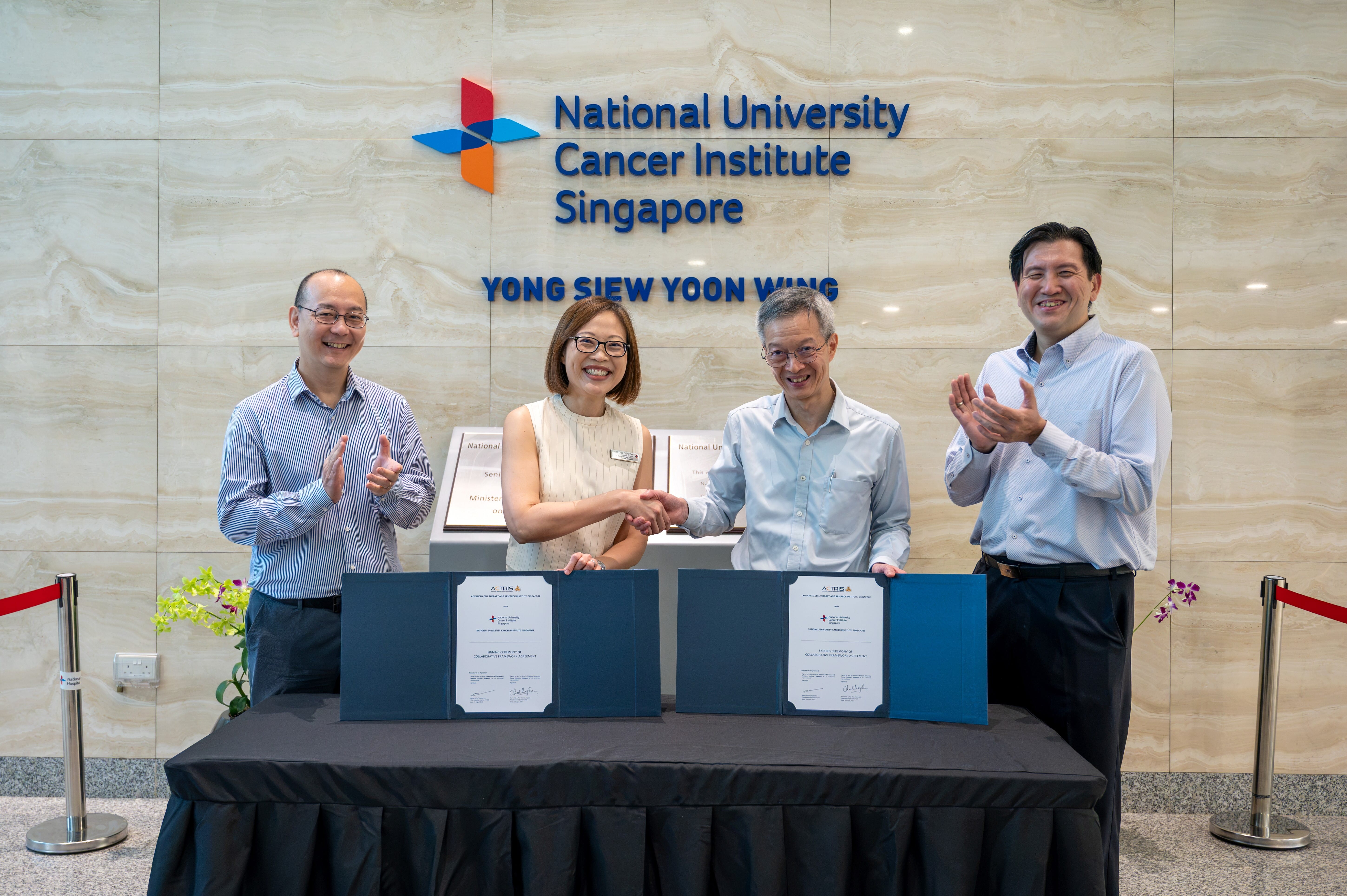 ACTRIS and NCIS representatives commemorating the signing of an MOU.